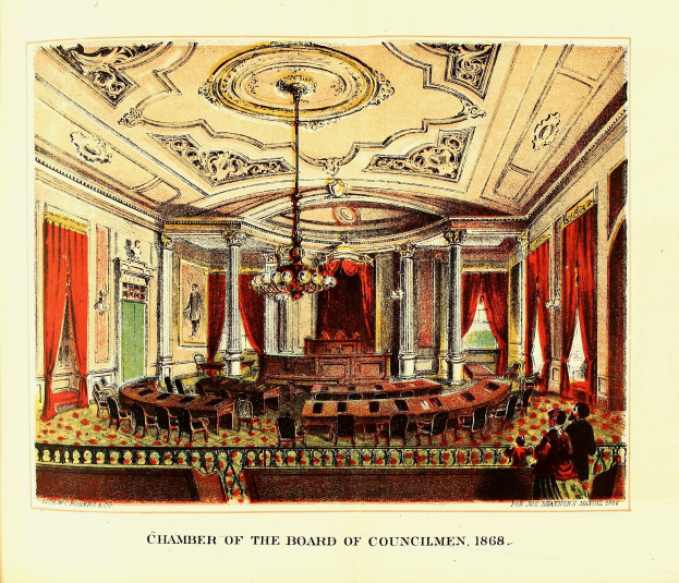 Eine Zeichnung des Sitzungssaals des Gemeinderats von 1868, die einen Raum mit Stühlen, Tischen, Vorhängen, Säulen, einem Kronleuchter und einer Decke zeigt, mit einigen anwesenden Personen und Text auf einem Papier.