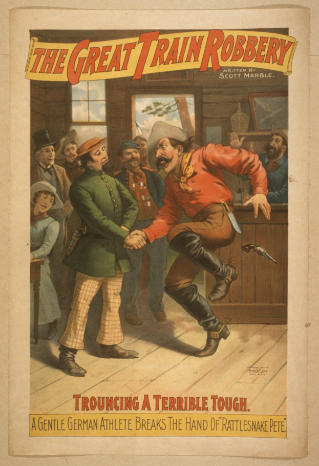 Plakat, das eine Gruppe von Menschen auf einem Boden zeigt, wobei einer eine Waffe hält, ein Fenster und eine Wand im Hintergrund und Text oben und unten mit der Aufschrift "The Great Train Robbery - Trouching a Terrible Tough".