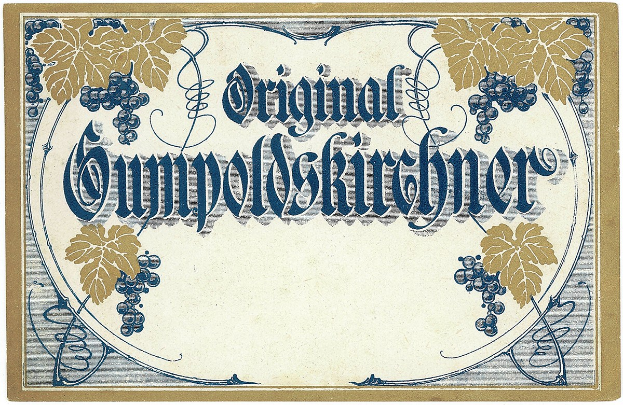 Ein altes deutsches Wein-Etikett mit einer Abbildung von Trauben und Blättern und einem Text, der den Wein-Typ angibt.